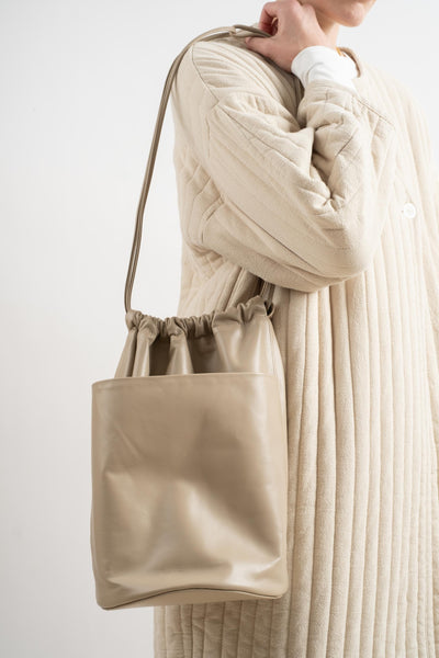 Tall Drawstring Slouch Pocket Bucket In Taupe