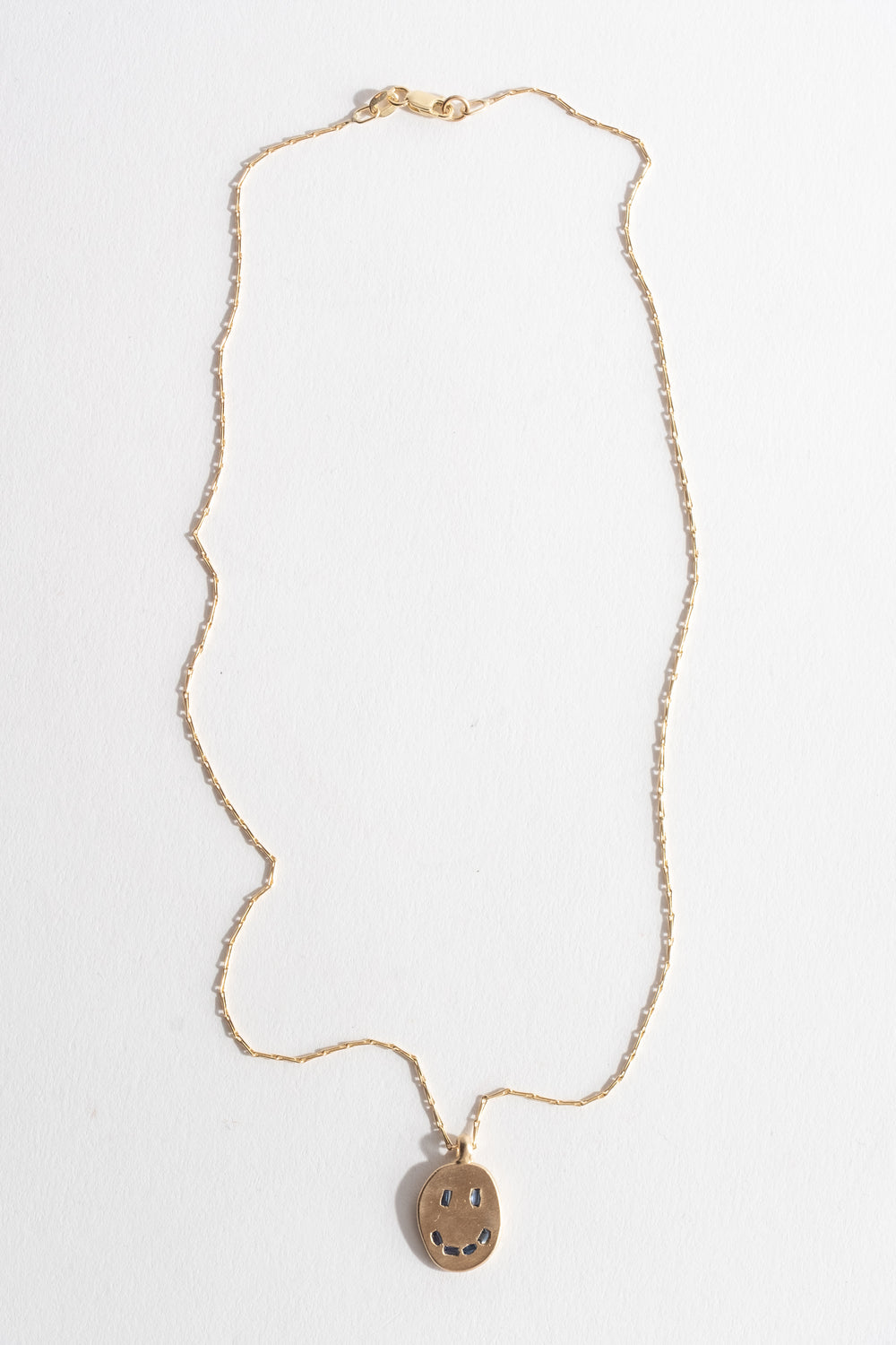 9K Sapphire Mask Pendant No. 34
