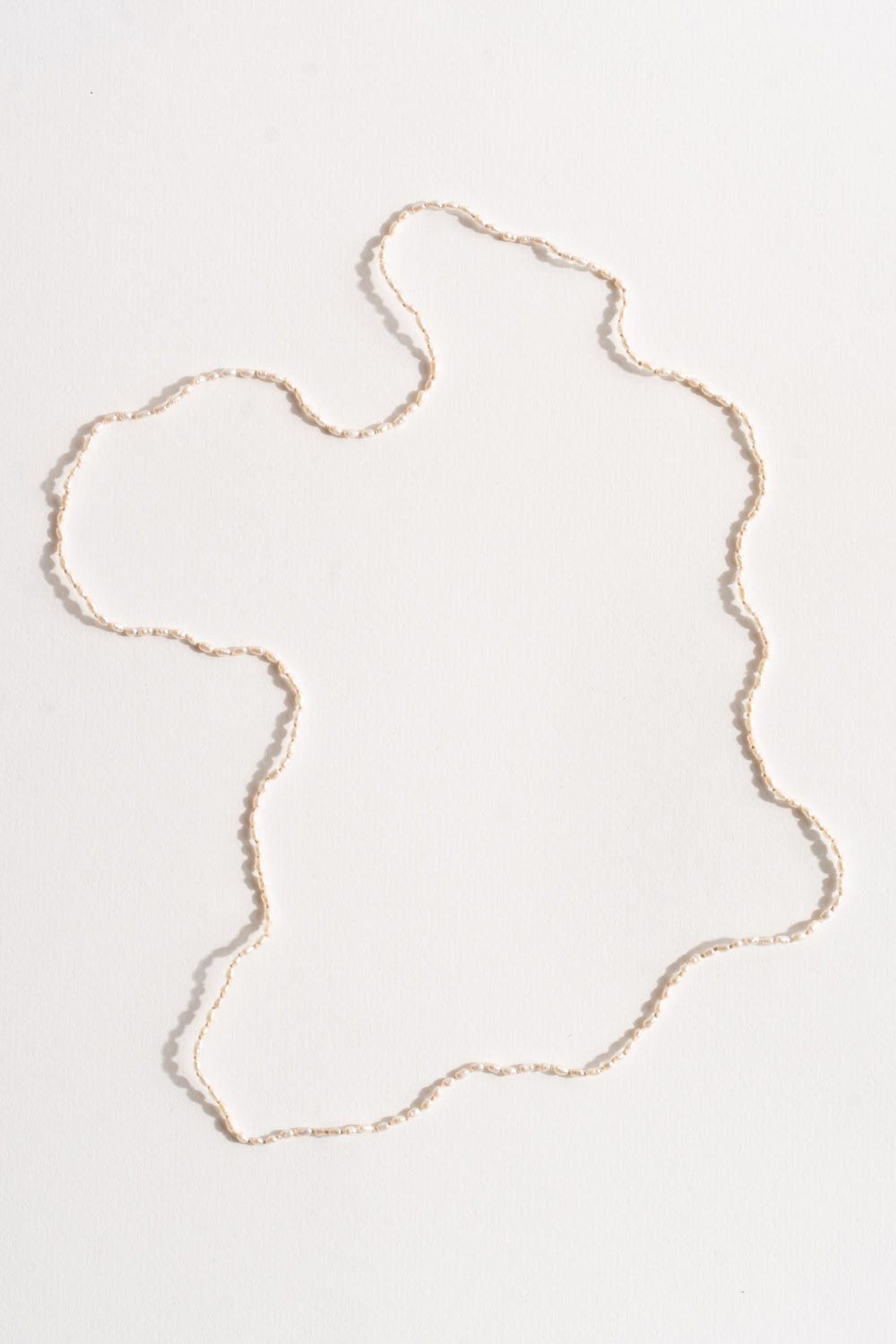 Tiny White Seed Pearl Strand