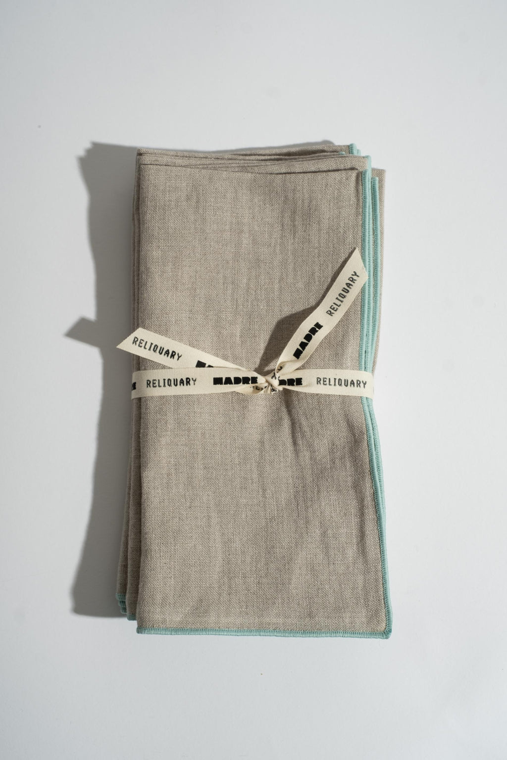 RELIQUARY X MADRE LINEN NAPKINS IN OYSTER