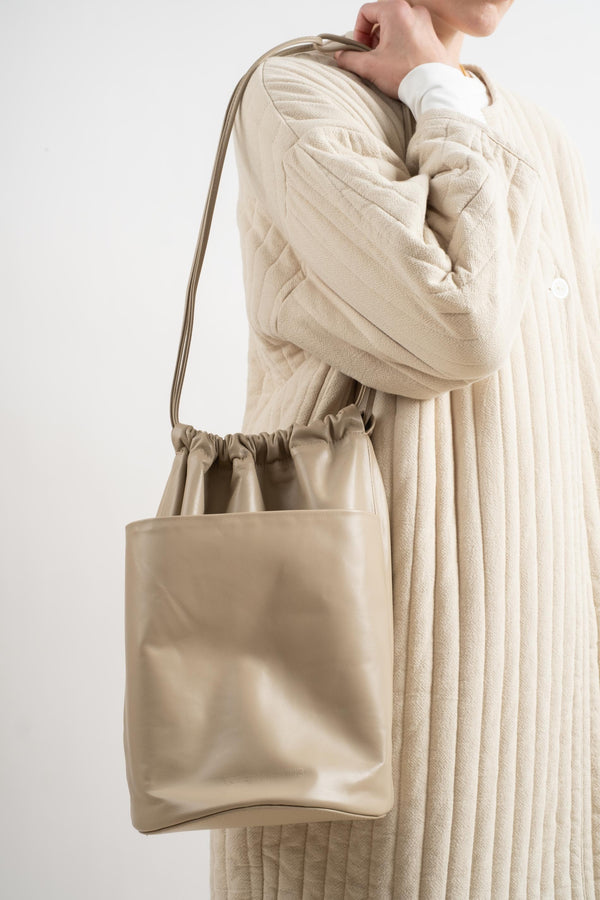 Tall Drawstring Slouch Pocket Bucket In Taupe