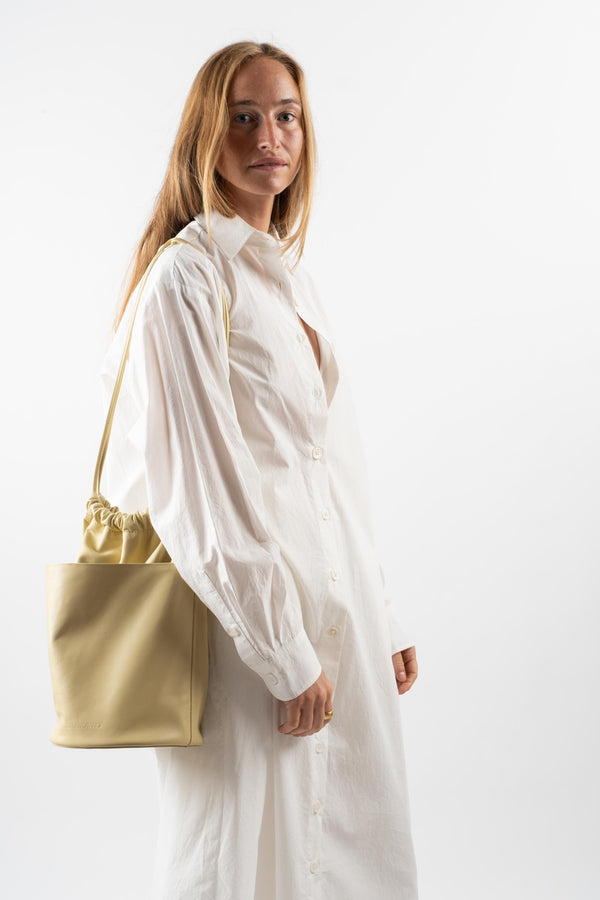 Tall Drawstring Slouch Pocket Bucket Bag in Butter