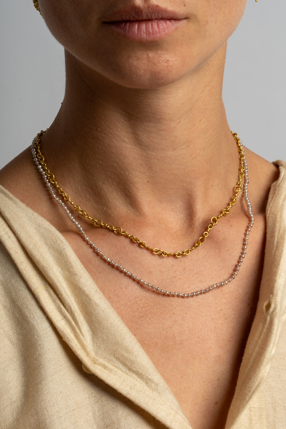 22K + Small Grey Seed Pearl Strand