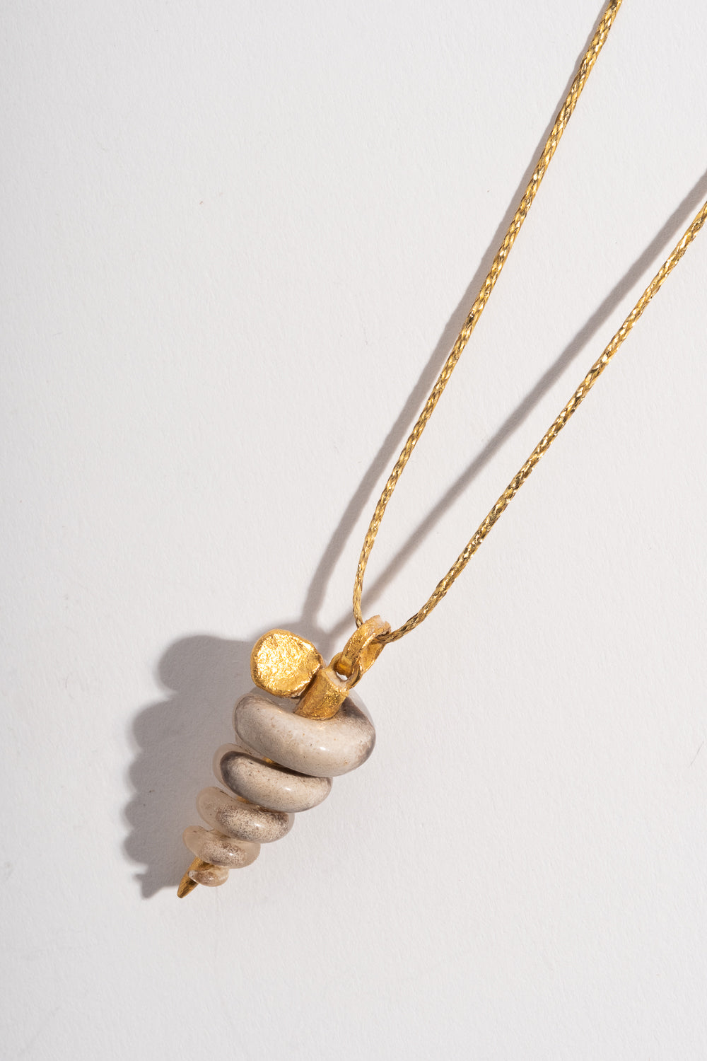 22K Gastropod Fossil Pendant