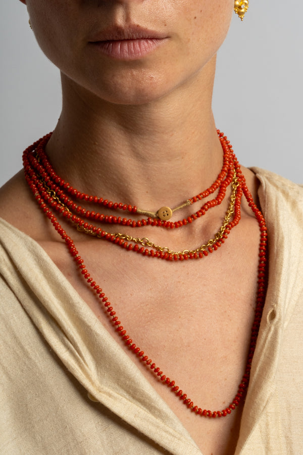 22K + Small Oval Coral Bead Strand