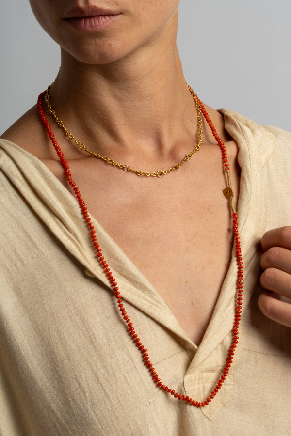 22K + Small Oval Coral Bead Strand