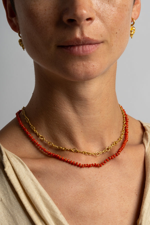22K + Small Oval Coral Bead Strand