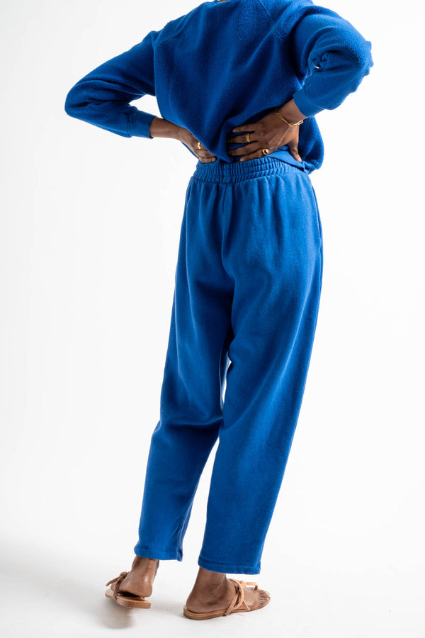 Person wearing a blue outfit on a white background