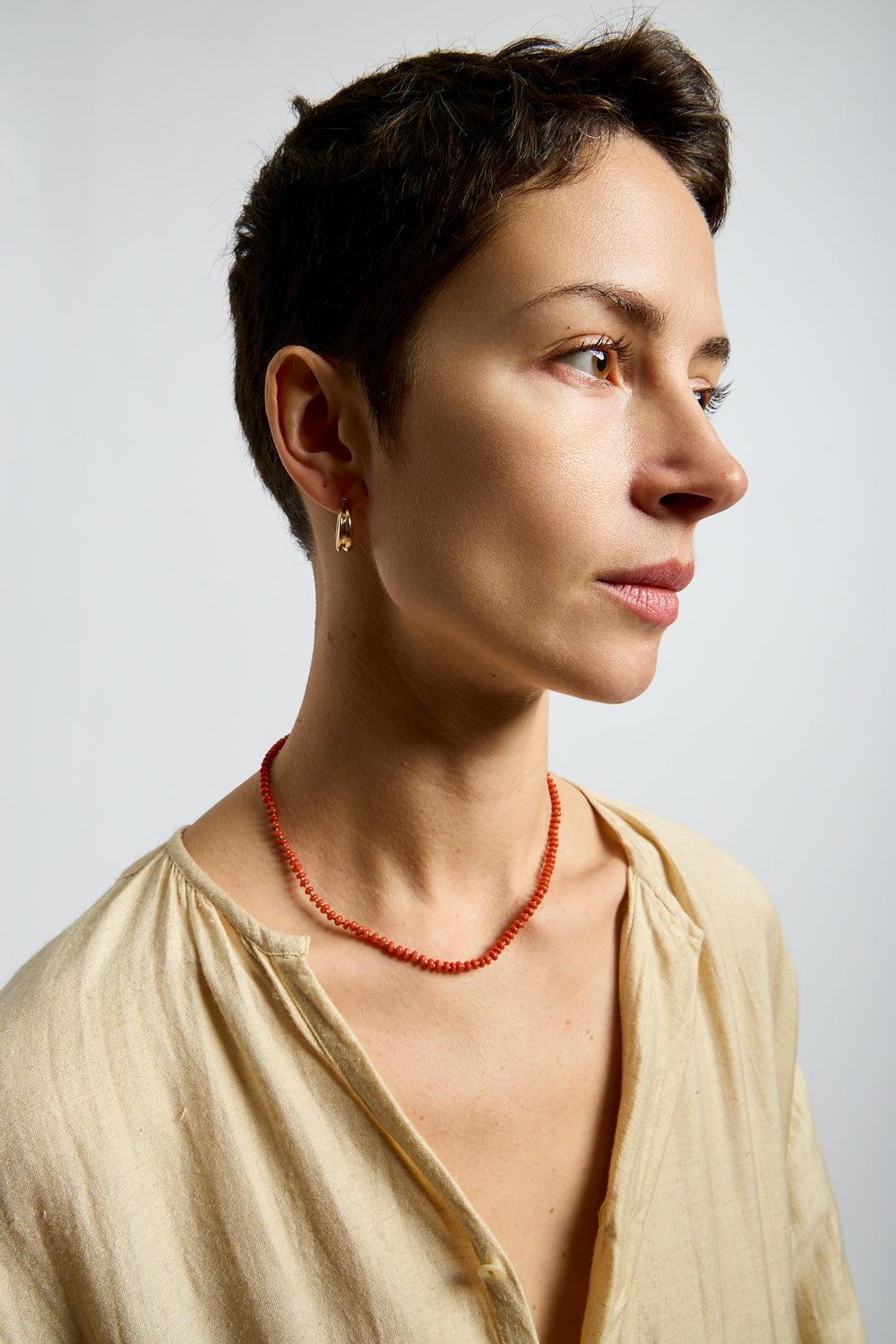 22K + Small Oval Coral Bead Strand