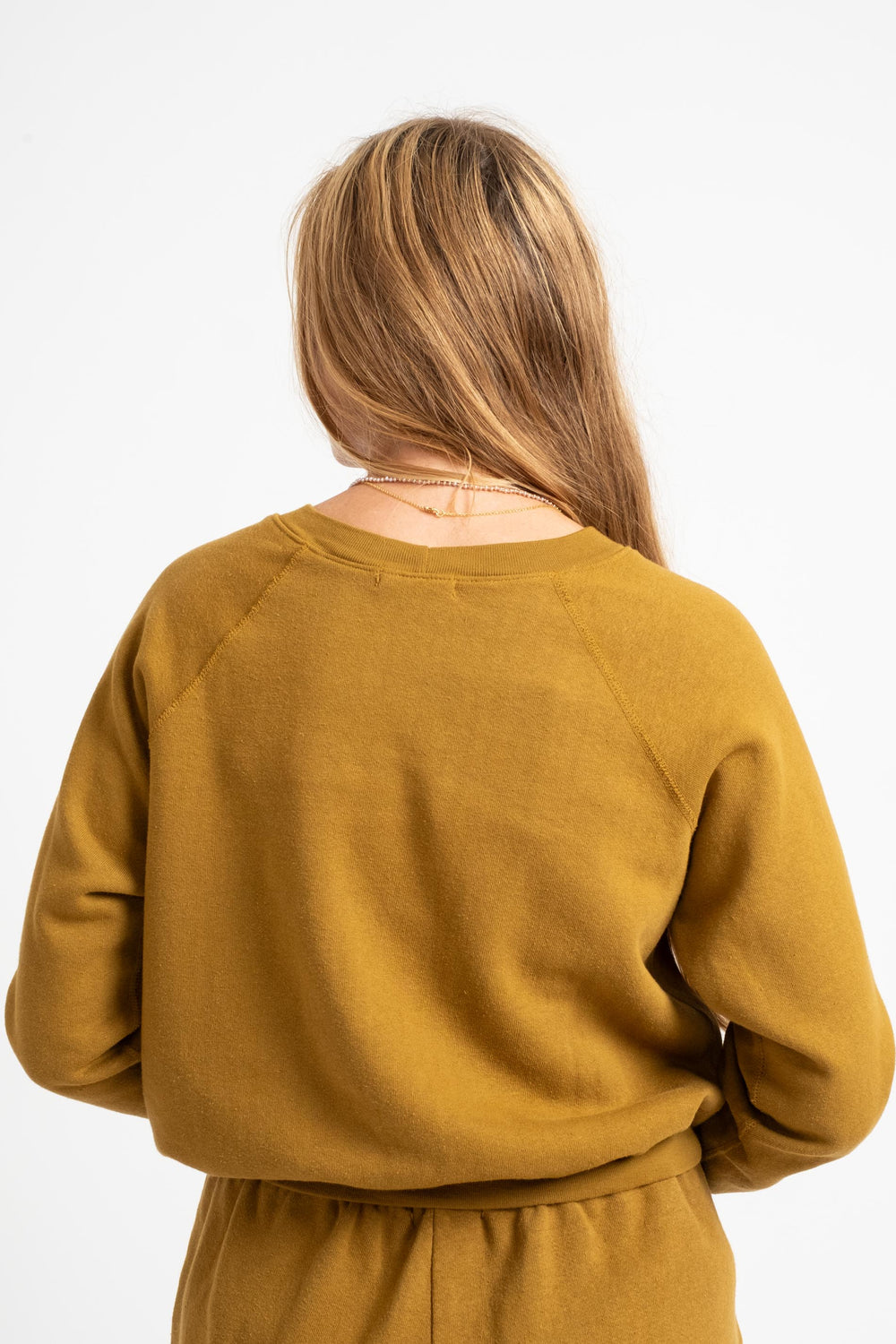 The Women's Crewneck Sweatshirt in Mustard