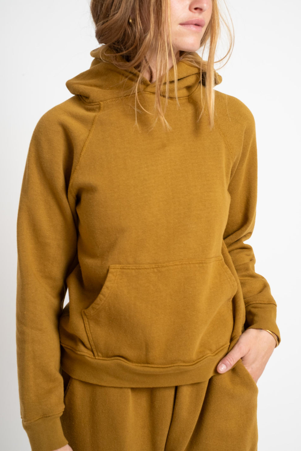 The Women's Hooded Sweatshirt in Mustard