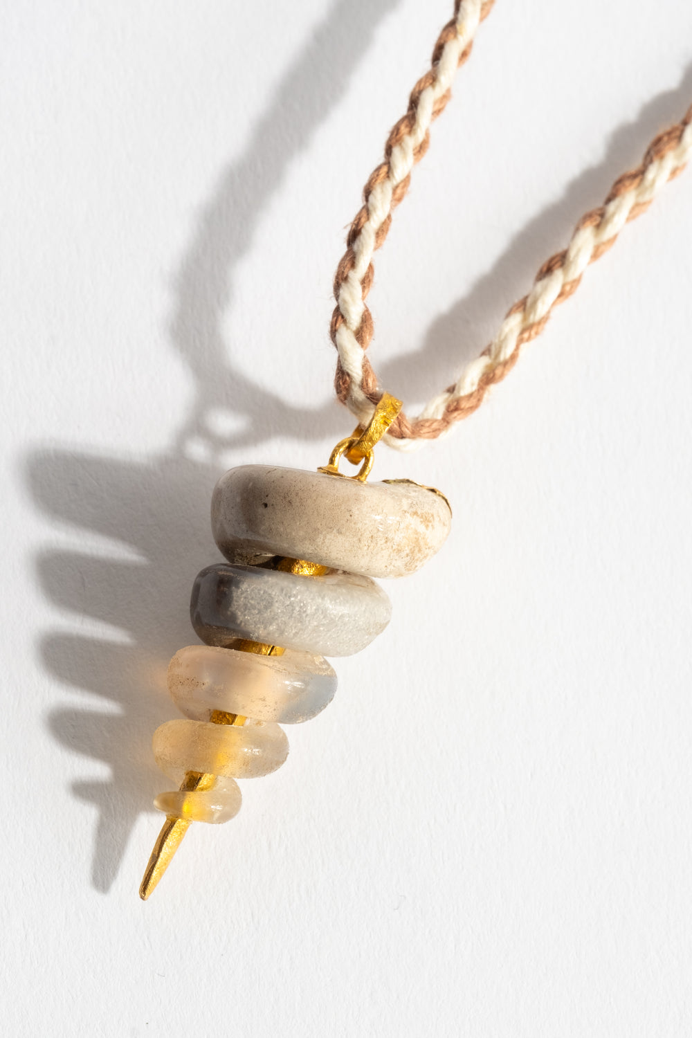 22K Fossilized Snail Pendant