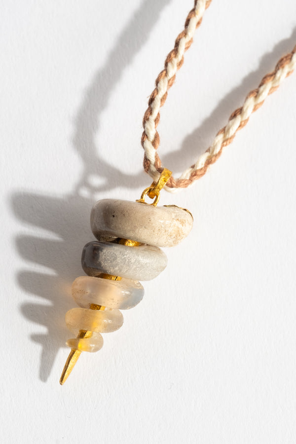 22K Fossilized Snail Pendant