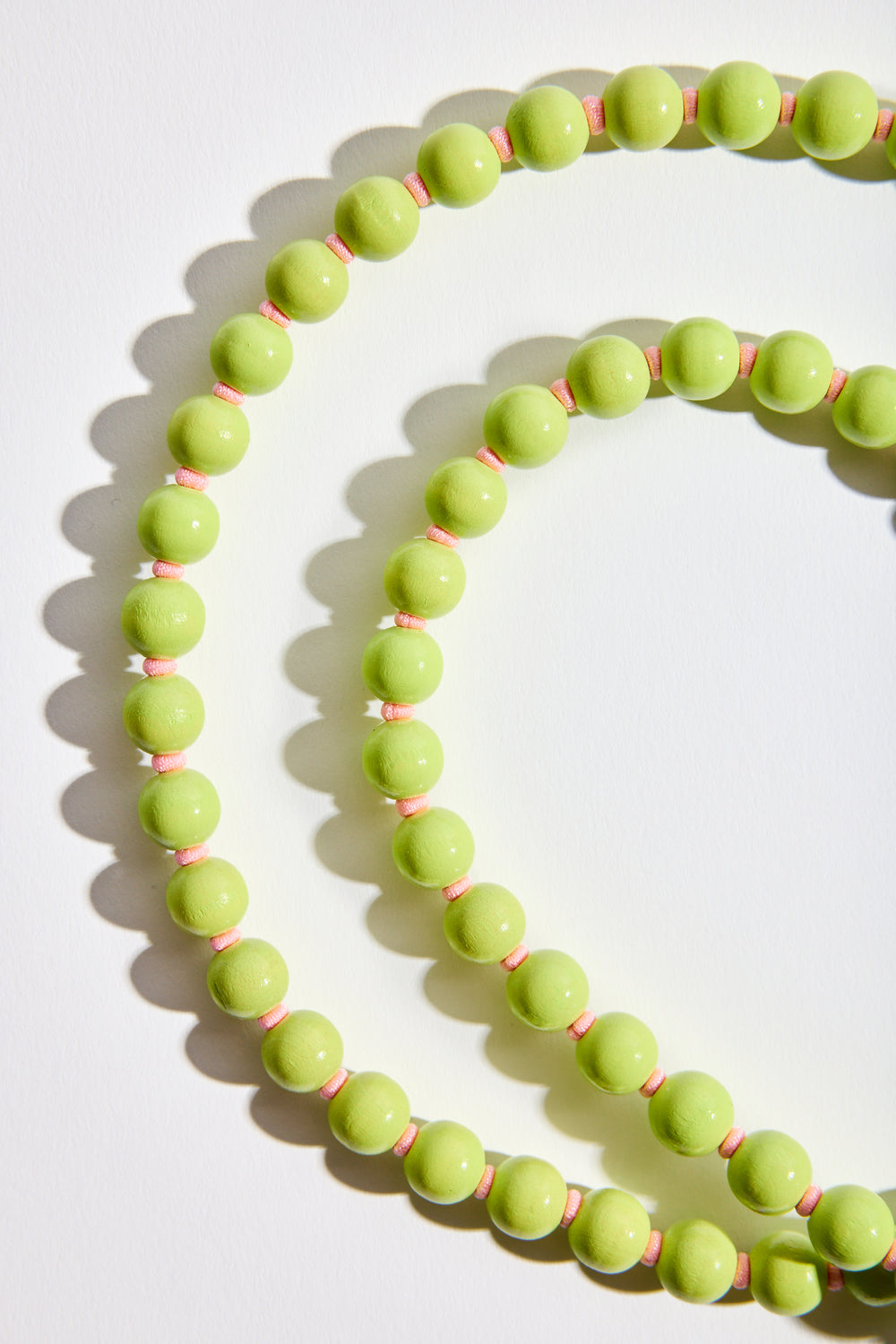 Phonenecklace in Lime + Rose