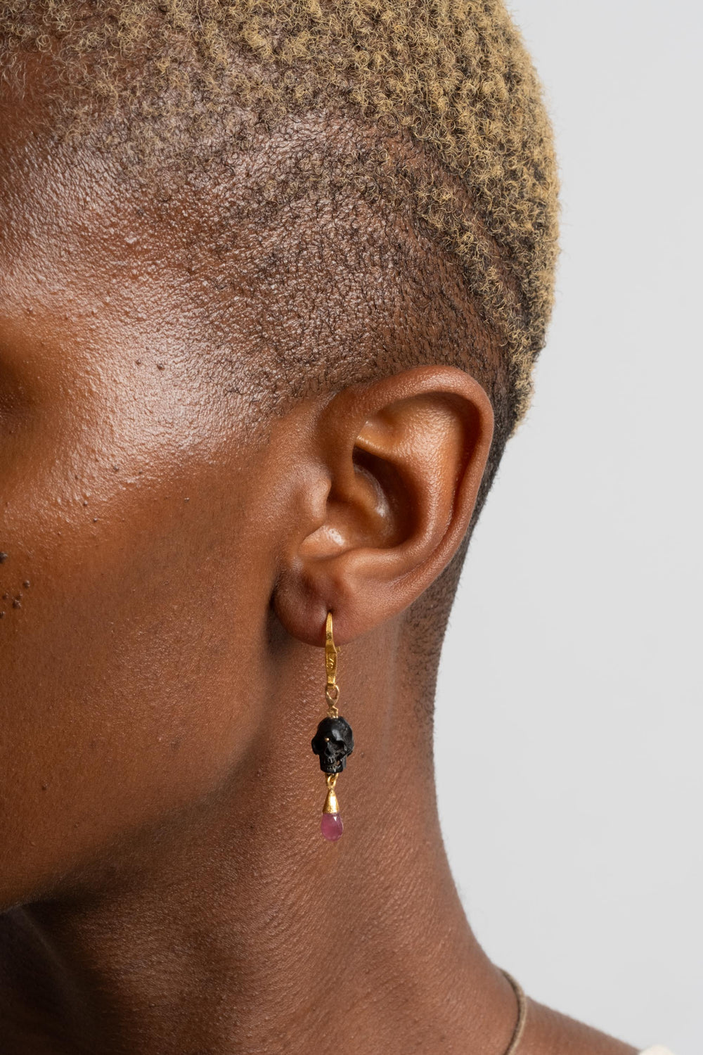 Lou Zeldis 22K + Ruby Skull Earrings on Model