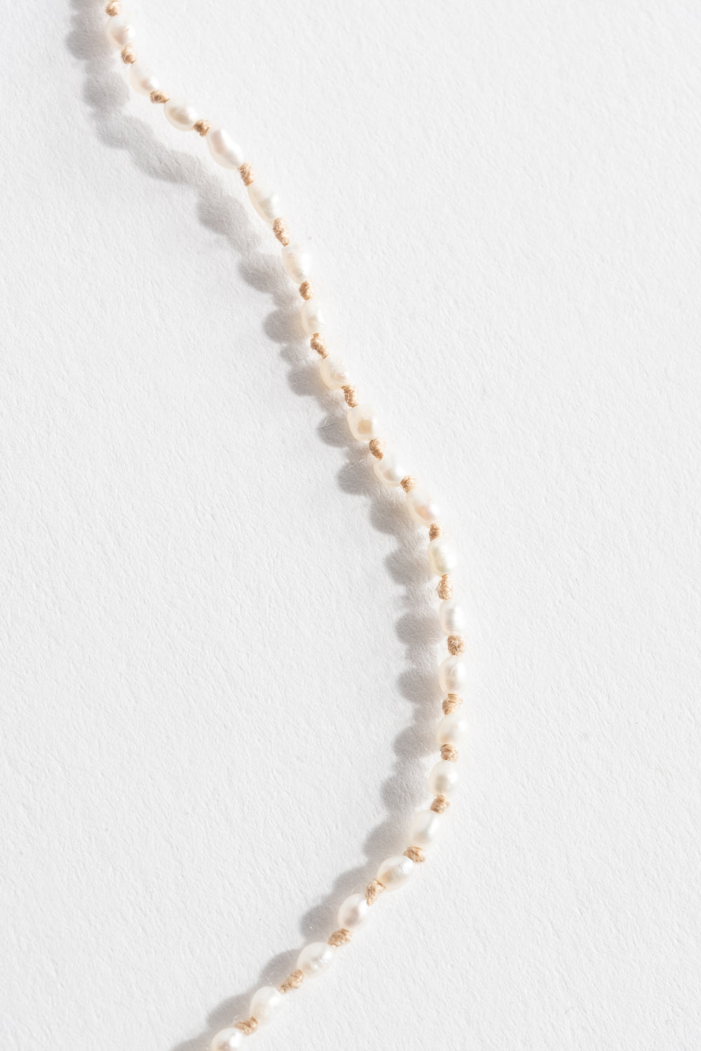 22K + Tiny White Seed Pearl Strand