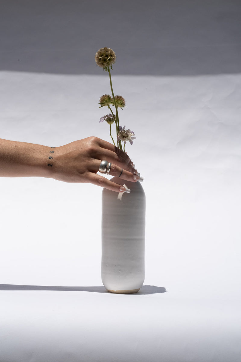 SMALL BOTTLE IN WHITE
